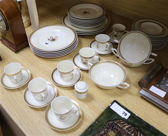 A Royal Copenhagen gilt decorated part dinner service and a Royal Doulton part service